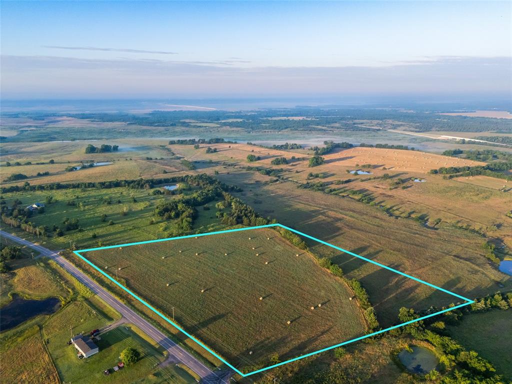 Positioned just south of Honey Grove along County Road 3444, this 11.91 acre tract sits directly in the path of growth surrounding Lake Ralph Hall, one of Texas' most anticipated new recreational lakes, currently under construction on the North Sulphur River and projected to cover nearly 7,600 surface acres upon completion. The back of the property overlooks the future lake footprint, giving the tract genuine long-term investment appeal as the surrounding corridor continues to develop. With approximately 0.17 miles of paved frontage along CR 3444, utilities available at the road, and gentle open topography, this is exactly the type of clean, versatile small-acreage tract that's growing increasingly difficult to find in North Texas. Currently ag exempt with minimal carrying costs, the property offers multiple paths forward, private homesite, weekend retreat, long-term investment hold, or future residential development. Planned zoning allows minimum ½-acre lots, giving buyers real subdivision upside as demand around this lake continues to build. Future lake amenities include public boat ramps, fishing access, hiking and biking trails, and designated hunting opportunities, all of which are expected to drive sustained buyer interest from both investors and DFW-area buyers seeking recreational and residential land within reach of the Metroplex. Conveniently located approximately 90 miles northeast of Dallas, 6 miles south of Honey Grove, and 16 miles east of Bonham, this tract offers a combination of paved access, utilities, subdivision potential, lake-view positioning, and DFW proximity. 

Disclaimer: The boundary lines shown are approximate and are provided for general reference only. Arrowhead Land Company makes no representations or warranties, express or implied, as to the accuracy, completeness, or reliability of those property lines. Buyers are advised to obtain an independent survey to verify exact property boundaries.