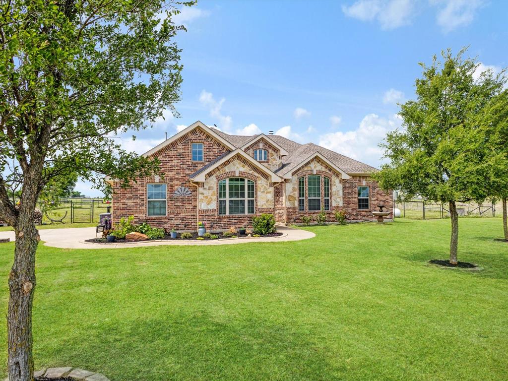 Welcome to your own private retreat in Ponder, where country living meets modern comfort on 1.72 beautifully maintained acres backing to more than 270 acres of open pasture. Set back from the road with no HOA, this 4 bedroom, 2 bath home offers privacy, scenic views, and room to spread out. Inside, you'll find a bright, open concept floor plan with a spacious kitchen featuring generous counter space, modern finishes, a large island with seating, and plumbing for propane, providing the option to install a propane range. The kitchen opens to the main living area, while two living areas offer flexibility for a game room, media room, home office, hobby space, or second sitting area. The oversized primary suite is complemented by a spacious walk in closet with custom built ins that maximize both storage and organization. Designed with dedicated jewelry and accessory drawers, shelving for shoes or handbags, and generous hanging space, the closet is as functional as it is beautiful. Step outside to the covered back patio with beautiful exposed wood beam accents, the perfect place to enjoy your morning coffee, entertain guests, or relax while taking in the views of the open pasture behind the property. With 1.72 acres, you'll have plenty of room to add a pool, shop, garden, or create the outdoor space you've always wanted. The fenced backyard provides a secure outdoor space, while the additional fenced acreage offers endless possibilities for horses, livestock, RV parking, recreational vehicles, gardening, or simply enjoying country living. The property also includes a storm cellar for added peace of mind. Recent updates include a roof and water heater replaced, oven replaced, and microwave replaced. Enjoy the privacy of country living, expansive pasture views, and the freedom that comes with 1.72 acres and no HOA, all just minutes from Denton and everyday conveniences.