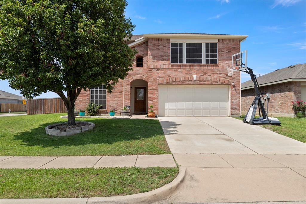 Beautifully maintained 4-bedroom, 2.5-bath home situated on a spacious corner lot in the desirable Eaglechase Estates community! This two-story home offers over 2,200 square feet of comfortable living space with a bright, open-concept floor plan perfect for everyday living and entertaining. The large kitchen features an island, breakfast bar, ample cabinet space, and opens seamlessly to the main living area with a cozy wood-burning fireplace.

Upstairs, all bedrooms are thoughtfully positioned for privacy, including an oversized primary suite complete with a garden tub, separate shower, and walk-in closet. Wood and ceramic tile flooring add warmth and durability throughout the main living spaces. Every window in the home is equipped with solar screens, helping improve energy efficiency, reduce heat gain, and enhance year-round comfort.

Step outside to an incredible backyard retreat featuring a stunning 30x20 all-cedar covered back porch — perfect for entertaining, relaxing, or enjoying Texas evenings year-round. The covered patio is enhanced with privacy shades installed on both ends, providing additional comfort and seclusion, and a third matching shade is stored in the garage and can be installed if desired. The backyard is fully enclosed with a newer privacy board-on-board fence featuring metal posts cemented 3 feet into the ground for enhanced durability and long-term stability.

Conveniently located near schools, parks, and easy access to Denton while still enjoying the charm of small-town living in Krum!

Tornado Master Storm Shelter and new saltwater hot tub are negotiable!