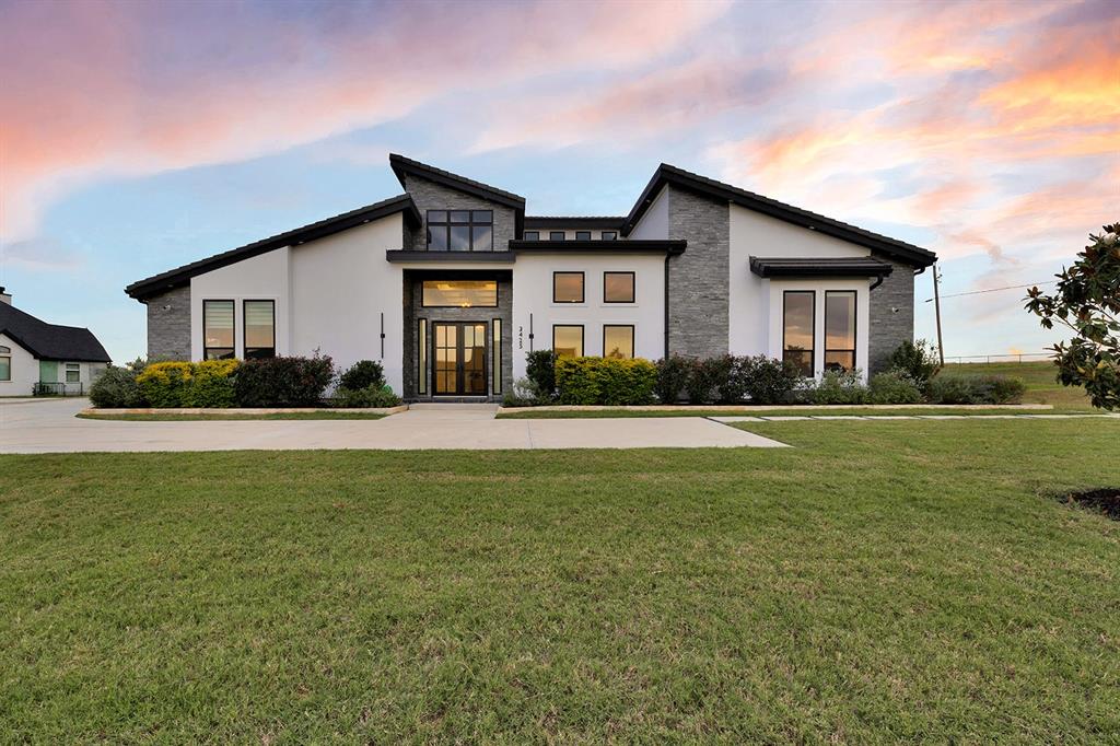 CORNER LOT ~ Nestled on 1.04 acres of pristine land, this stunning residence epitomizes the pinnacle of modern luxury, offering an expansive living space of over 5,200 square feet. Meticulously designed with an eye for sophistication, this custom-built home features four spacious bedrooms and 4.5 elegantly appointed bathrooms, ensuring ample room for both relaxation and entertainment.
Step into a world of opulence as you enter the expansive media room, thoughtfully equipped with a state-of-the-art surround sound system for an immersive cinematic experience. The property boasts two distinct living areas, each providing a unique ambiance for gatherings and quiet evenings alike. A dedicated study or office space allows for productivity in a serene environment, perfect for those who work from home.
Culinary enthusiasts will be delighted by the commercial-grade, stainless steel kitchen, showcasing top-of-the-line appliances that redefine gourmet cooking. The kitchen is a chef's dream, featuring dual dishwashers, six powerful gas burners, and a convenient pot filler faucet, complemented by luxurious, imported hardware that adds a touch of elegance. The oversized island provides an impressive centerpiece for meal preparation and casual dining, while an abundance of cabinetry ensures that storage is never a concern.
Enhancing the allure of this magnificent home are the exquisite marble floors that flow fluently throughout the property, reflecting light and lending an air of sophistication to every corner.

Info provided is deemed reliable, but is not guaranteed & should be independently verified. Buyer or Buyer's Agent to verify measurements, schools, & tax, etc.