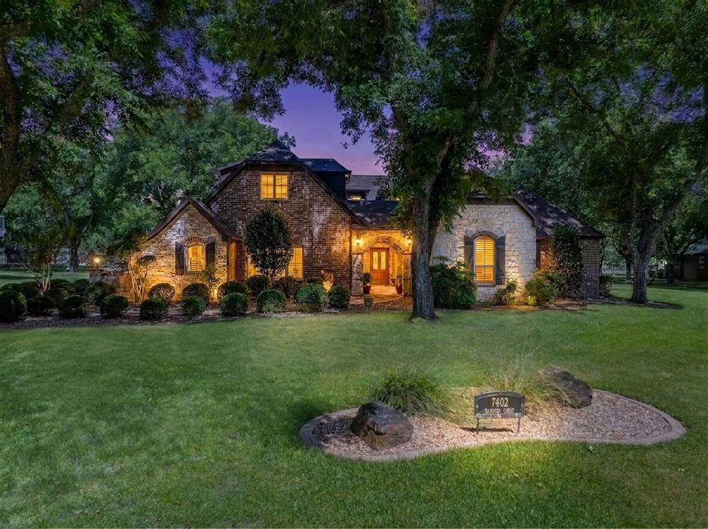 Welcome to resort style elegance in the prestigious, gated community of Pecan Plantation! This breathtaking 4,307 sqft estate has been meticulously curated with over 95,000 in premium upgrades brand-new septic system, whole-house water filtration with reverse osmosis, whole house generator, new water heater, fresh interior paint, and upgraded hardware throughout. Your private outdoor paradise awaits  a stunning pool & spa with waterslide, temperature cooled pool, new aluminum pool fence, and a fully appointed outdoor kitchen perfect for entertaining under the Texas sky. A private 816 sqft guest quarters with full kitchen, bedroom and bath offers flexible living for family or visitors along with a 543 sf detached garage-shop with electric. Inside, no detail has been overlooked with plantation shutters and high end finishes. Upstairs could be used as media room or additional bedroom. High impact class 4 roof 3 years old, sprinklered yard, orchard water near front gate entrance. Beyond your gates, Pecan Plantation delivers an unmatched lifestyle golf, marina, stables, Brazos River access, tennis, two airstrips, and an on-site community complete with dining, medical, grocery & 24 7 EMS. Minutes to charming downtown Granbury, 1 hr to Ft. Worth. Can come with transferable Nutcracker golf membership avoiding the long waitlist. This one is truly move in ready!