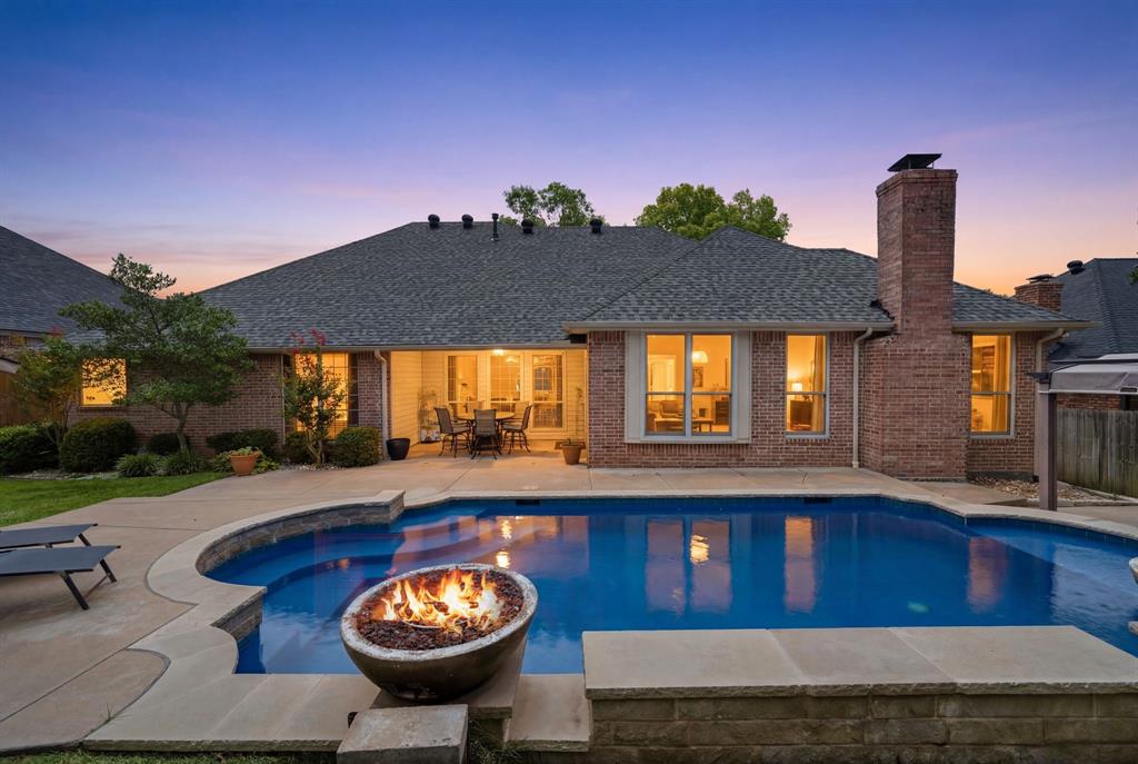 Welcome to 428 Arbor Lawn Drive, a beautifully maintained single-story home offering a thoughtful living space in one of Burleson's most established and sought-after neighborhoods.The grand double-door entry and timeless curb appeal make a striking first impression. Step inside to a bright, airy floor plan flooded with natural light from soaring floor-to-ceiling windows and accented by elegant crown molding. Just off the entryway, a private dedicated home office provides the perfect quiet space for remote work. Built for both comfortable daily living and effortless hosting, the home features two living areas, including a main formal living room equipped with built-in surround sound. The gourmet kitchen opens directly to the breakfast nook and a second living area centered around a classic brick fireplace. Tucked away on its own side of the smart split-bedroom layout, the generous primary suite serves as a true retreat, featuring an large sitting area and a luxurious dual-sided fireplace that connects the bedroom to the ensuite bath. The secondary bedrooms are all spacious, each featuring its own walk-in closet for exceptional storage. Step outside to your private outdoor oasis, where an oversized backyard is anchored by a sparkling heated swimming pool designed for year-round enjoyment. The exterior features a large covered patio perfect for outdoor dining, a full automatic sprinkler system to keep the lawn pristine, and a storage building with electricity. Ideally located in the heart of Burleson, this peaceful property offers a quiet, neighborly feel while keeping you just minutes from top-rated local schools, shopping, dining, and major commuter routes.