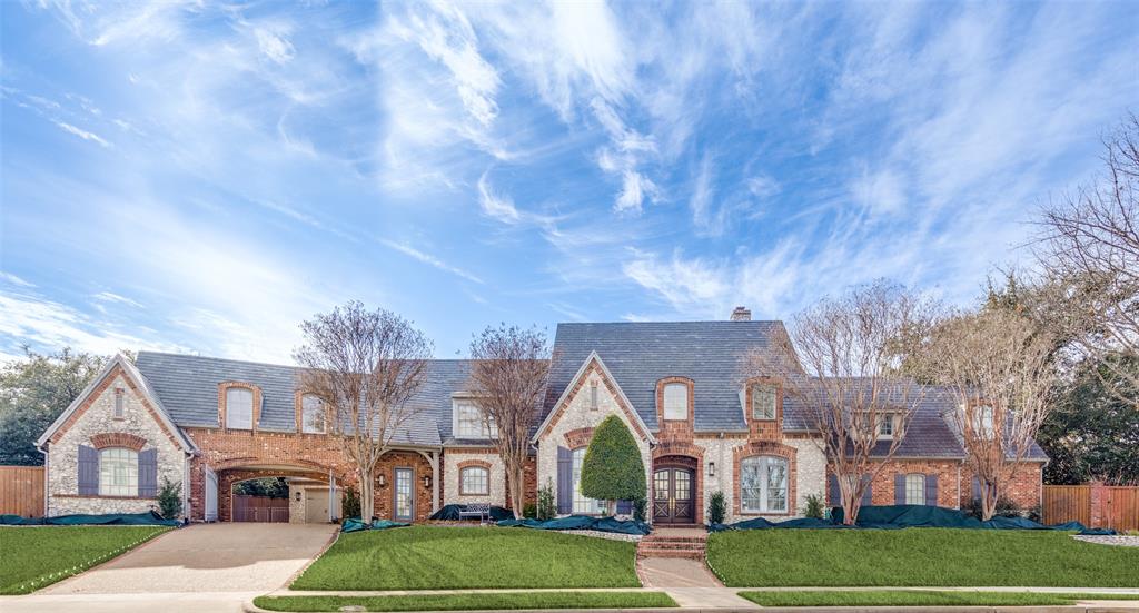 Discover this luxurious estate on a .57-acre lot in one of Plano’s most exclusive neighborhoods. Designed for elegance and comfort, the home features detailed finishes, wood beams, and a sophisticated light palette. The grand entrance leads to soaring ceilings, expansive living areas, and a gourmet kitchen with quartz countertops, updated appliances, and a Gaggenau wine refrigerator, oven, and sous-vide oven.
The main level boasts a serene Owner's Suite with a remodeled bath, a guest suite, and fresh interior paint. Upstairs, enjoy three large bedrooms and a game room.The resort-style backyard is an entertainer's dream, with a pool, covered seating areas, infrared heaters, a fireplace, Italian pizza oven, outdoor kitchen, lighted tennis court, and grassy play space. Recent upgrades include new landscaping, water heaters, a water osmosis system in the kitchen , and AC in the third garage.This exquisite home offers unparalleled luxury and functionality in the coveted Willow Bend Country neighborhood.