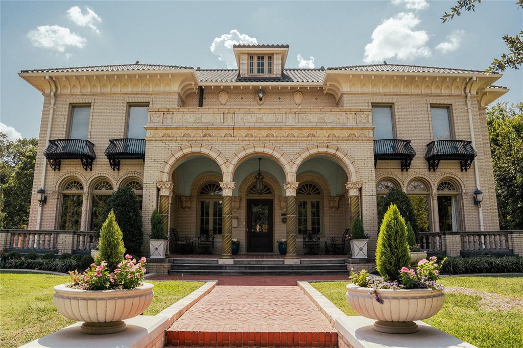 Welcome to The Dulaney House! An Italianate treasure standing proudly at the east end of Elizabeth Boulevard in the heart of Ryan Place.
Spanning 5,753 square feet, this historic residence offers a rare blend of timeless character, architectural beauty, and modern comfort. From the moment you arrive, sculptural arches and the distinctive green terra cotta detailing set the tone for the elegance that unfolds within.
Inside, the marble-floored entry and hand-painted trompe l’oeil ceiling create a grand first impression, opening into a stunning living room anchored by a hand carved stone fireplace. The home features five spacious bedrooms, three full baths, two half baths, and two plush living areas—each space thoughtfully enhanced to preserve the home’s historic charm while supporting today’s lifestyle.
An additional 784 square feet of finished basement space provides flexible living options ideal for a game room, home gym, or private entertaining retreat.
Step outside to a backyard setting that feels truly cinematic. Enjoy a covered patio, stand-alone pavilion, and a sparkling pool with cascading waterfalls—all designed for memorable gatherings and quiet evenings alike.
Just beyond the pool, a beautifully finished 702-square-foot guest house offers its own living room, bedroom, eat-in kitchen, laundry, and private patio overlooking the water—perfect for guests, multi-generational living, or a secluded workspace.
Admired for generations and featured in designer tours and publications, The Dulany House presents a rare opportunity to own one of Fort Worth’s most iconic historic homes.