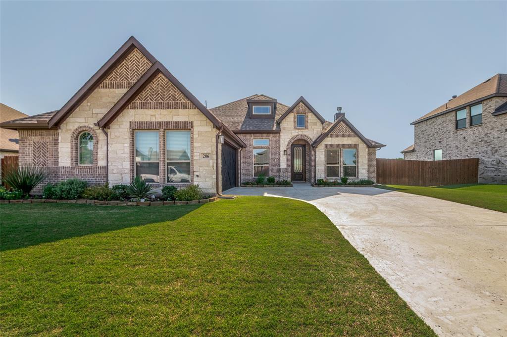 Built in 2024 by Bloomfield Homes, this beautifully designed single-story home offers the perfect blend of style, comfort, and peaceful backyard views. A striking brick-and-stone elevation, J-swing entry, and manicured landscaping create impressive curb appeal from the moment you arrive. Inside, the home features wood floors throughout the main living areas, recessed lighting, abundant natural light, and an open layout designed for everyday living and entertaining. The spacious island kitchen is a standout, offering quartz countertops, generous prep space, and a seamless connection to the dining and living areas. The living room is anchored by a beautiful stone fireplace with a mantel and raised hearth, creating a warm and inviting focal point. Large windows across the back of the home frame the true highlight of the property: peaceful views of walking trails and ponds with no neighbors directly behind. Whether you are enjoying morning coffee, relaxing after work, or entertaining guests, the backyard setting offers a rare sense of privacy and openness. The private primary retreat is thoughtfully designed with a spacious bath featuring an oversized shower with bench, creating a comfortable and relaxing escape. Additional bedrooms provide flexible space for family, guests, or a home office. Out back, the covered porch extends the living space outdoors and overlooks the scenic greenbelt views. A garden shed adds convenient storage while keeping the yard neat and functional. With its 2024 construction, single-story layout, upgraded finishes, scenic backyard setting, and no rear neighbors, this Bloomfield-built home offers a special combination of beauty, privacy, and everyday livability. A 3D online tour is available for buyers who would like to virtually tour the home before seeing it in person.