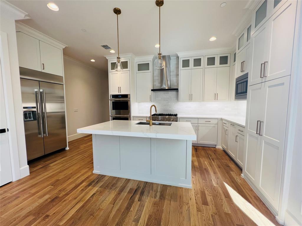 Looking for the perfect luxury home with amazing features and an unbeatable location? Look no further than this brand new construction home! Situated in the highly coveted HPISD, this 5 bed 5 bath home boasts incredible luxury features that are sure to impress. Enjoy cooking in the stunning kitchen, complete with a gas range, built-in refrigerator, dual ovens, and a wet bar with wine refrigerator for entertaining.Spacious bonus room for a home theater or game room. Unwind in the master suite with en-suite bath, complete with a rain shower, soaking tub and large walk-in closet. The 2-car epoxy garage with storage provides ample space for vehicles.Fenced-in side yard with turf.Located within walking distance of Highland Park High School, shops,and restaurants, it is an ideal location for convenience and entertainment.