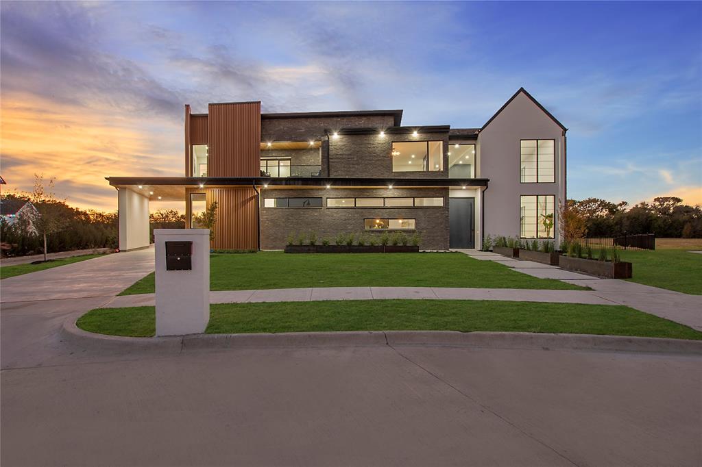 Welcome home to 1112 Glen Abbey Court, a breathtaking architectural masterpiece crafted by the renowned DCI Home Builders. Nestled on 1.328 acres in the prestigious Providence community, this one-of-a-kind estate blends innovative modern design with timeless transitional elegance to deliver an unparalleled luxury living experience. Inside, every detail of this 5,998 square-foot home has been meticulously designed to impress. The grand living spaces are bathed in natural light from soaring ceilings and expansive windows, creating a seamless connection between indoors and out. At the heart of the home is a chef's dream kitchen, complete with a stunning double waterfall Taj Mahal quartz islands, farmhouse sink, hidden walk-in pantry, double ovens, and sleek custom cabinetry. This culinary haven flows effortlessly into the open-concept living and dining areas, making it perfect for hosting lavish gatherings or intimate family dinners. The private primary suite is a true retreat, thoughtfully located away from the main living areas for ultimate tranquility. It boasts a spa-inspired bathroom and an expansive walk-in closet that redefines luxury. Upstairs, additional bedrooms with en-suite baths offer privacy and comfort for family and guests alike. Step outside to your private backyard oasis, where sleek modern design takes center stage. Enjoy a luxurious pool, outdoor shower, covered patio, and fully equipped outdoor kitchen. This space is perfect for entertaining, relaxing, or simply enjoying the Texas sunset. Conveniently located just minutes from fine dining, shopping, and everything Heath has to offer, 1112 Glen Abbey Court is more than a home—it’s a lifestyle. Schedule your private showing today and make this masterpiece your own. Don’t just live—elevate.