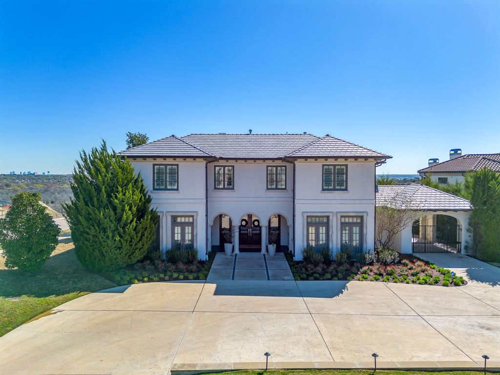 Tucked away on a quiet, private cul de sac, this stunning estate offers an unparalleled blend of sophistication, comfort and architectural beauty. From the moment you arrive in the guard gated community of Montserrat, you are greeted with manicured grounds and impeccable homes. This home offers the most beautiful curb appeal, complete with lush landscaping, a grand entry with a circular drive and meticulous attention to details that sets the tone for what lies within. Step inside to discover a thoughtfully designed interior, featuring soaring ceilings, expansive windows, and an abundance of natural light. The open concept living spaces are inviting and warm, ideal for entertaining or cozy nights at home with family. A chef's kitchen anchors the home, complete with premium appliances, built ins and a white oak custom island. The dramatic bar features a wine cooler, ice maker and beverage drawers. There is a separate formal dining room and a large butlers pantry for serving and storage. The downstairs office allows for privacy and allows for the ease of working from home. The primary suite is conveniently located on the first level and ensuite marble bathroom with spacious walk-in closet. Additional bedrooms are on the second level, all with ensuite baths and large closets. There is an incredible game room upstairs with an additional sun room that offers sweeping views of downtown. The resort style backyard offers several spots for enjoyment, including an oversized landscaped green area and a turfed dog run. The patio, fire pit and pool are all oriented towards the city views and are set up high to enjoy these views day and night. The sunrise in the mornings lights up the entire first level of the home with orange and pink hues. This home is located on nearly an acre and is conveniently located on a corner lot. While the neighborhood offers amenities to gather with neighbors in the park, fishing pond or pool, the home offers unparalleled privacy.