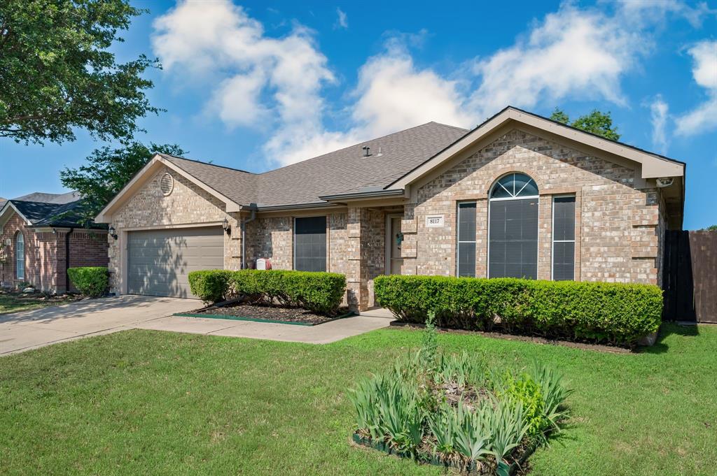 Welcome to this beautifully maintained single-story home located in the highly sought-after Keller ISD! Offering 5 spacious bedrooms, a dedicated home office, and a 2-car garage, this home combines comfort, functionality, and thoughtful updates throughout. Ideally situated near shopping, dining, major highways, and outdoor recreation including nearby Arcadia Trail Park for hiking and biking, this home offers the perfect blend of convenience and everyday living. Step inside to discover bright, open-concept living spaces filled with abundant natural light and warm, inviting finishes throughout. The cozy living room is anchored by a beautiful brick wood-burning fireplace, creating the perfect space for relaxing evenings at home. The spacious eat-in kitchen is a true centerpiece, featuring brand-new stainless steel appliances, abundant cabinet space, a breakfast bar, kitchen island, walk-in pantry, and an easy flow into the main living area, making entertaining effortless. A split-bedroom layout provides added privacy, while the oversized primary suite serves as a peaceful retreat complete with a soaking tub, separate shower, and a spacious walk-in closet. Designed with both comfort and practicality in mind, the home also features a full-sized laundry room with additional storage space. Step outside to your private backyard oasis where a beautiful pergola-covered patio creates the perfect setting for outdoor cookouts, entertaining guests, or simply enjoying quiet evenings at home. Surrounded by mature landscaping and a generous grassy area, this move-in-ready home truly has it all. Schedule your showing today before it’s gone!