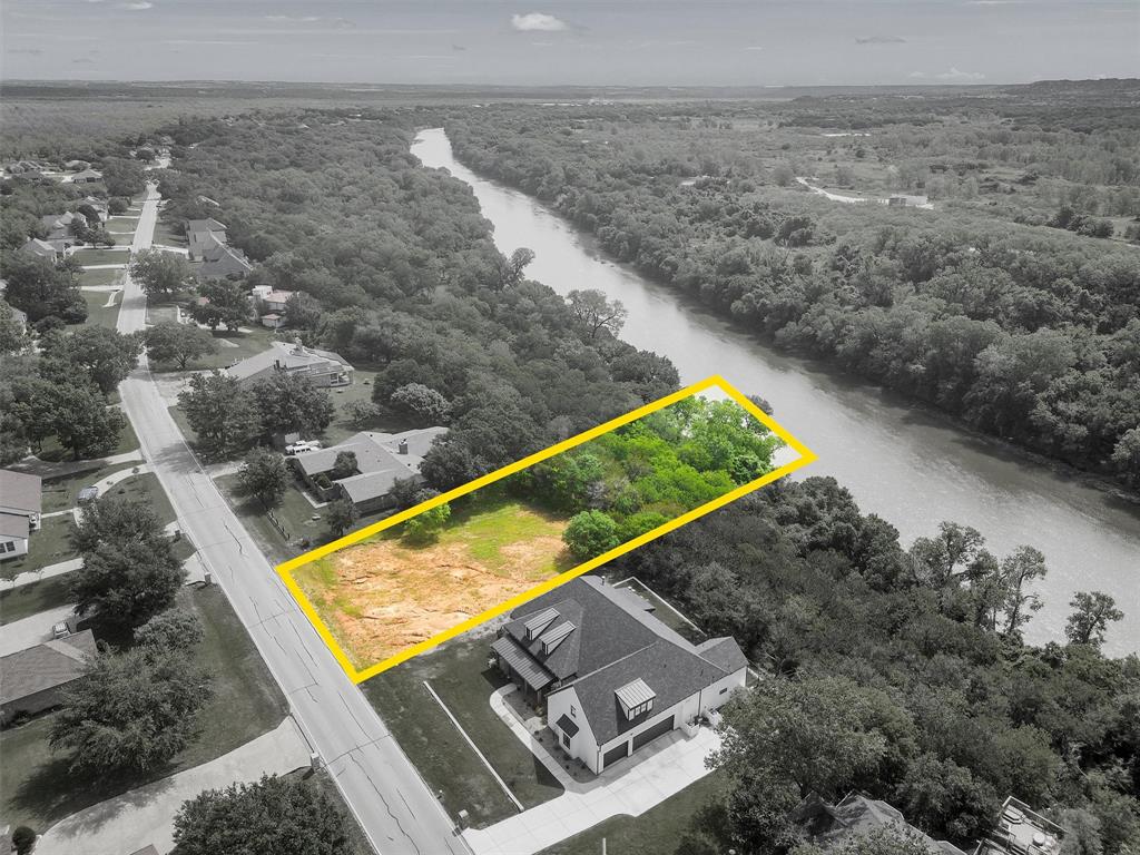 OWN A SLIVER OF THE RIVER IN PECAN PLANTATION GOLFING COMMUNITY! Nice 0.810 acre Brazos riverfront lot is calling your name. Views of the Brazos River and a backdrop of majestic trees for your own private oasis. Great investment opportunity, as these lots are few and far between. Recent survey. Come build your dream home and enjoy the laidback lifestyle Pecan offers. Abundant wildlife and birds. Property is near clubhouse, golf courses, beach, playground, marina and other Pecan amenities and businesses. Just a short distance from the historic Granbury Square, with quaint shops, restaurants, art galleries, wineries, opera house, music venues and weekend festivities. An hour's drive to downtown Ft. Worth. Come check it out!