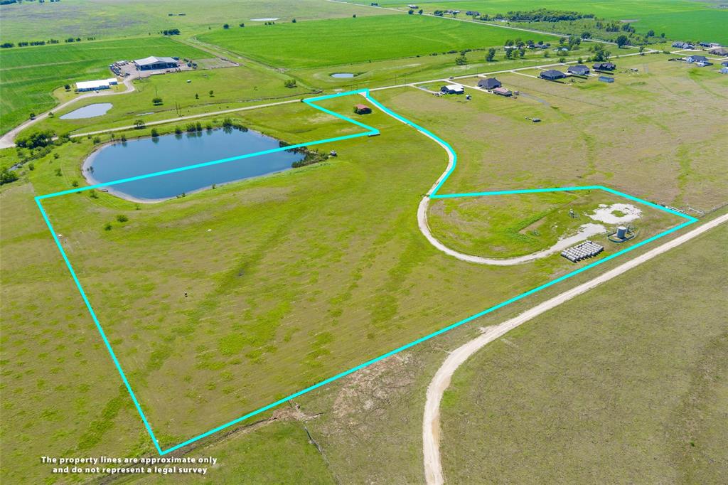 Wide open Texas skies, asphalt road frontage, and a pond with gazebo and deck set the stage for this 14.136 acre tract. Head through a gated entry with cattle guard along County Road 408 in sought after Grandview ISD, this gorgeous property offers open pasture, a gravel drive, and a barn built for the true country lifestyle. The pond is stocked with catfish, bass, and perch, perfect for fishing right on your own land. Electricity is available on site. Property includes an existing Trinity water well, a valuable improvement for future homesite or agricultural use. Whether you are dreaming of a custom estate, a weekend escape, or a working ranch, this land delivers the space, serenity, and scenery to make it happen. Buyer to verify all information including utilities, easements, and acreage.