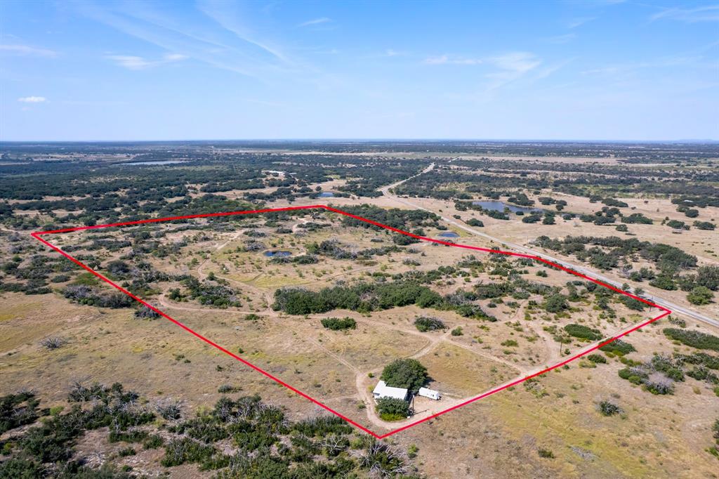 Hunters and outdoor enthusiasts from across the country have long enjoyed this fully equipped 44.8-acre retreat, and now it could be yours! There are several excellent homesites, and the land is well-suited for agriculture or other outdoor pursuits. Access is easy via a farm road, just minutes from Brownwood. Gently sloped with majestic oaks and mesquite, fully fenced, and carefully managed, the property offers abundant wildlife, including whitetail deer, hogs, turkey, dove, and quail. It is supported by 12 heavy-duty blinds (6 ground, 6 elevated), 6 feeders, multiple cameras, and a tank over 20 feet deep.

The 900 sq ft camp under a sturdy canopy, with 2 campers hooked up to electricity and water, is move-in ready. Grills, fridge, freezer, and furniture all stay with the sale. 

About 3 hours from Austin and Dallas, 4.5 hours from Houston, and 20 minutes from Lake Brownwood, it’s convenient for weekend retreats or year-round living. This isn’t just land, it’s a versatile property ready to create memories, enjoy the outdoors, and pursue your vision. Call today to tour this one-of-a-kind retreat!