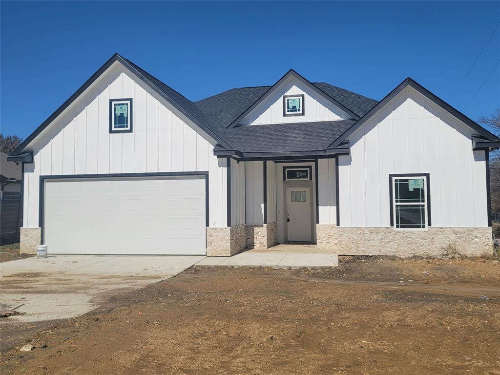 Beautiful new construction on a corner lot, featuring 3 bedrooms, 2 bathrooms, a dedicated study—perfect for a home office or flex space, laundry and mud room with 2 pantries. Beautiful new construction on a corner lot, featuring 3 bedrooms, 2 bathrooms, a dedicated study—perfect for a home office or flex space, laundry and mud room. Beautiful wood-grain tile flooring runs throughout the home. Spacious living room with a herringbone- tiled gas fireplace perfect for relaxing or entertaining. Each bedroom offers generous space, spacious closets with ceiling fans in each room. The primary luxurious ensuite suite with dual sinks, custom tile work with a large walk-in closet. Open kitchen design featuring double-stacked white cabinetry with black accent hardware, granite counter tops, modern lighting, with stainless steel appliances. Additional features include an oversized garage, central air, extra pantry space.