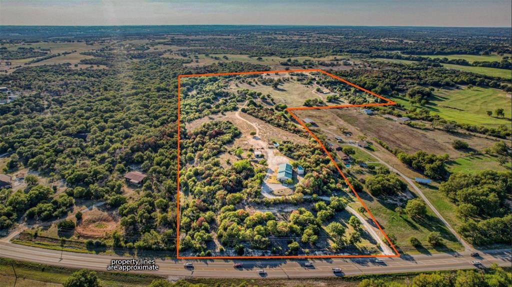 61+ ag exempt Weatherford acres with Hwy 51 frontage for private ranch, homesite, development, investment hold or even commercial use. Mix of mature trees & open pasture. Property includes established electric, water well & septic. The 61+ac includes a barndo with large attached shop - easily used as is for a commercial office or repair shop. A 2nd shop adjacent to the barndo large enough for RV-boat storage, paint booth, mechanic shop & material storage. Revenue ready with 50 roll door storage units with immediate income potential. Conveniently located 10 minutes from downtown Weatherford. Minimal to no restrictions. Pad sites started for more commercial structures or cleared for pasture use. Txt keyword RANCH3 to 88000 for survey & more info.