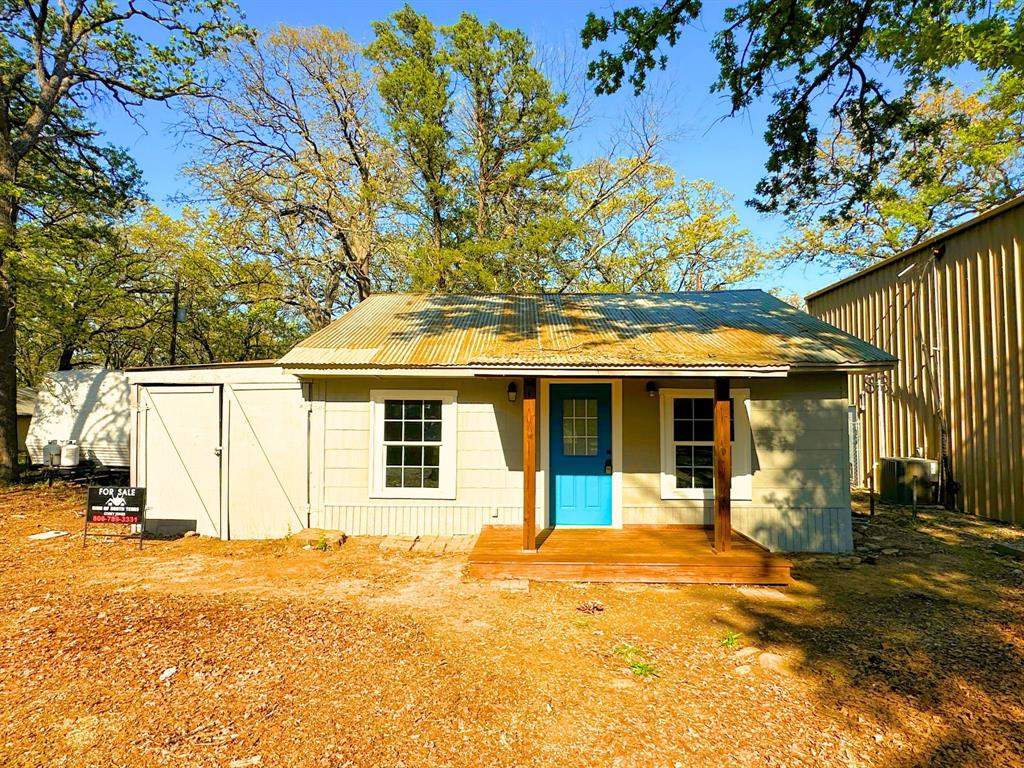 Charming lake-area retreat located in the desirable gated community of Cedar Point  near Lake Texoma! This cozy 2-bedroom, 1-bath home offers approximately 708 square feet of efficient living space, making it the perfect weekend getaway, or low-maintenance escape.  The home features a functional single-story layout with a blend of carpet and vinyl flooring, a freestanding electric range, and a comfortable living area. A one-car covering with side parking provides added convenience, while the surrounding lot offers shade from mature trees and a relaxed, tucked-away feel.
Situated in the Cedar Point Boat Club subdivision, this property places you just minutes from lake access, boating, and outdoor recreation—ideal for those looking to enjoy everything Lake Texoma has to offer. Located within Whitesboro ISD, this property combines affordability with location and lifestyle.
Whether you're searching for a weekend retreat or a simple place to unwind near the water, this property offers excellent potential at an attractive price point.