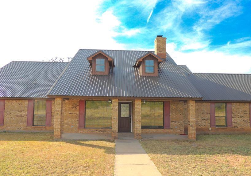 The stars shine bright deep in the heart of Texas at this charming country home located just outside the city limits, offering sweeping views in every direction. With so much space, versatility, and potential, this property delivers the peaceful lifestyle you’ve been dreaming of. Inside, you’ll find 3 nicely sized bedrooms, a large downstairs living area featuring a classic brick wood-burning fireplace, and a well-designed kitchen with excellent storage, quartz countertops, a breakfast bar, and an attached dining area. The large upstairs second living area makes the perfect game room, media room, or even a 4th bedroom—the choice is yours. Step outside to enjoy a front patio with impressive “mountain” views and a back porch and patio overlooking the premium metal-fenced backyard. The property also includes a large barn with extra parking and a spacious enclosed garage, giving you plenty of room for equipment, hobbies, or storage. This is the Texas country retreat you’ve always imagined—space, scenery, and serenity all in one place.