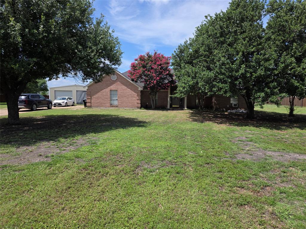 When entering this subdivision, you are immediately greeted with a quaint sign that says A Great place to Live. 4-bedroom, 2-bath brick home in the peaceful, HOA-free w community of The Crossings. Attractive brick homes on spacious one-acre lots and wide concrete streets create a welcoming atmosphere and lasting curb appeal. Widely regarded as an excellent place to live, Lowry Crossing offers the perfect balance of peaceful rural living and large-lot homes while remaining just minutes from McKinney's shopping, dining, and conveniences. Situated on a sprawling 1-acre lot, this property offers space, and functionality. Major improvements include a roof (June 2026), AC unit (late 2025), and comprehensive foundation repair (2025) with a fully transferable lifetime warranty. Inside, the functional floor plan features four bedrooms, a spacious living area, formal dining room, cozy breakfast nook, and a versatile game room, providing plenty of room for everyday living and entertaining. Beautiful hardwood floors, comfortable bedroom carpeting, and a new living room floor installed in 2025 add warmth and style throughout. The original attached two-car garage has been thoughtfully converted into a game room with durable concrete floors, while the detached garage or workshop measuring approximately 32'x30' under roof features two overhead doors and ample space for vehicles, storage, hobbies, or projects. The fully fenced backyard offers room for pets, play, gardening, and outdoor entertaining. With a McKinney mailing address, Lowry Crossing flexibility, and access to acclaimed Princeton ISD schools, this move-in-ready property delivers the best of country living with city convenience. Don't miss this rare opportunity to own a home, and room to live, work, and play.