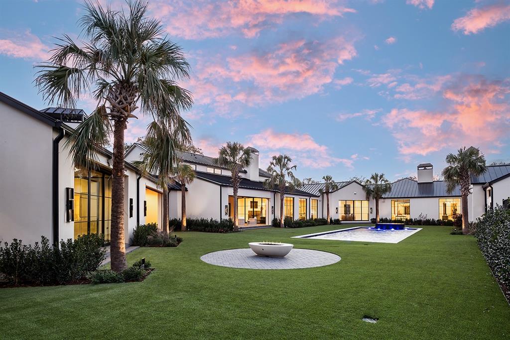 Owner financing available for qualified buyers with 25% down at 6.5% interest. New construction by Crescent Estates behind a walled & gated 1.8-acre estate in the heart of Old Preston Hollow offers a resort-style experience in one’s own backyard. Primarily one-level home with sleek modern design, warm transitional finishes & an incredible U-shaped floor plan, ideal for entertaining & everyday living. Vaulted great room with chef’s kitchen opens onto one of multiple covered terraces, all overlooking the 42-ft pool, spa & regulation sized lighted tennis court. Opposite is the primary wing including a sitting area, gym, large closets & dual spa-like bathrooms flanking a private courtyard. 3 ensuite bedrooms & playroom are on an adjacent wing. A private 2-room suite is located through an open-air loggia & connects to an entertainment pavilion with fireplace & fully-equipped kitchen.Upstairs is a two-bedroom suite with living room and kitchen, ideal for multigenerational living or au pairs.