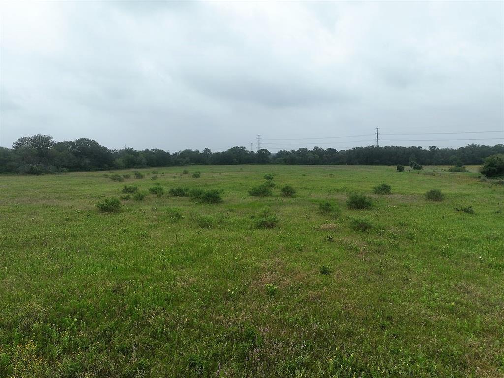 11.876-acre tract that is mostly cleared with a few scattered trees & a small section at the rear of the property that is heavily treed, secluded and quiet down a paved County Road. Located about 7 miles outside of town, this is county living at its finest! Several building sites just waiting for you to come in and build the home of your dreams. The boundary is fenced on 3 sides with 7 strand wire. Bring your animals, there is plenty of pasture to roam and room to build a barn or arena if you please. Don't hesitate, it won't last long!