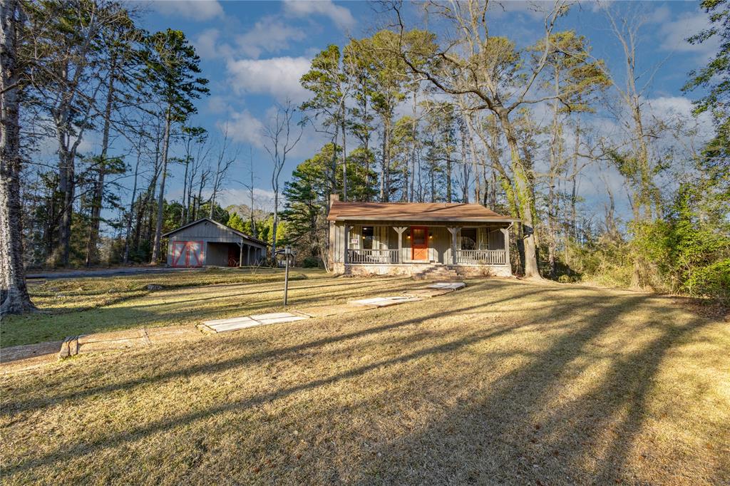 Here is your opportunity to own a peaceful home retreat in the pines, part time getaway or full time living, just outside the Historical & picturesque town of Mineola. This home has 2-bedrooms, both have generous closet spaces installed closet systems, shelfing & 2 separate baths, (1 full bath) The home features a galley kitchen, major appliances are included as an electric wall oven, dishwasher, electric stovetop with a breakfast area. Large living-dining combo with brick WBFP. The original builder built the home for his personal residence with craftsmanship and attention to detail. A relaxing sunroom-screened back porch off kitchen with patio door, 11'6 X 11'4 offers views to the property and occasional deer! A laundry room with a washer & dryer and additional storage closets. There are many perennial plantings which will bring stunning Spring, Summer & Fall color. The home has recent stained cedar siding and brick skirting. A grand front porch across the front with a porch swing and extra space for your rockers! A detached 1 car garage, with attached carport & shop area within the door. Property has 2.06 acres consisting of a cleared area and pines for a picturesque site. There is a well but will need new pump if you would like free landscape watering. The home, however, has community water. Recently, the property was a profitable and popular VRBO with repeat customers. Several recreational and fishing lakes in area, Lk Hawkins, Lk Holbrook and the famous Lk Fork, a Trophy Bass Fishing destination. Escape the stress and enjoy the peaceful lifestyle in East Texas, just east of Historical Downtown Mineola with dining, shopping, medical services and entertainment, including the historic theater at Lake Country Playhouse offering first-run movies, classic films and live performances like plays and concerts in a vintage setting.