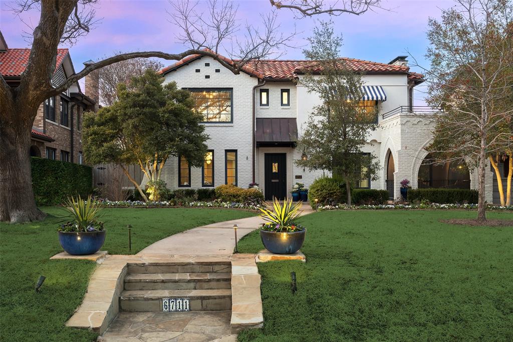 6711 Lakewood Blvd melds historic charm and modern luxury on Lakewood's iconic street, a short walk to White Rock Lake and on the Dallas Marathon and 4th of July Parade route, enriching community life. Once owned by Alfred Dines of Dines & Kraft, who developed the neighborhood in the 1930s, this Spanish-Eclectic style home boasts a rich history and original features like hand-forged railings and arches, alongside updates like an open kitchen, Viking range, Subzero fridge, and pellet ice maker. Modern amenities include an elevator, generator, self-cleaning pool, Marvin sliding doors, and a whole-house security system. The master suite offers luxury with a spacious bath, impressive closet, office or sitting room, and elevator access. Numerous outdoor spaces are designed to facilitate an indoor-outdoor lifestyle. The house is zoned to award-winning Lakewood Elementary. This special property perfectly combines the elegance of its historical roots with the comforts of modern living.