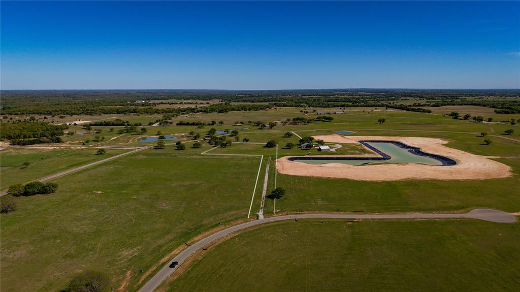 Discover a better way to live - this picturesque 3+-acre property is nestled within a secure, gated community of Stonebridge.  This boutique community offers resort-style amenities such as the owners club, recreational lakes, planned equestrian center, hiking & riding trails, community garden, event pavilion, dog park, kids clubhouse, pickleball courts, & soccer fields.  Lot 61 has an established gravel driveway that welcomes you onto the land guiding you to a wide-open pasture that provides an ideal, ready-to-build homesite with plenty of room to create your dream retreat.  This lot is positioned beside one of the recreational lakes providing you with serene views.   Located just minutes from the charming & historic town of Bowie, TX which provides conveniences, restaurants, shopping, Bowie ISD & home of the Trade City Second Monday Trade Days.  Whether you’re envisioning a peaceful country escape or an active lifestyle immersed in nature, this property offers the best of both worlds—space to breathe, exceptional amenities, and a thoughtfully designed community that makes a neighborhood feel like a real community!