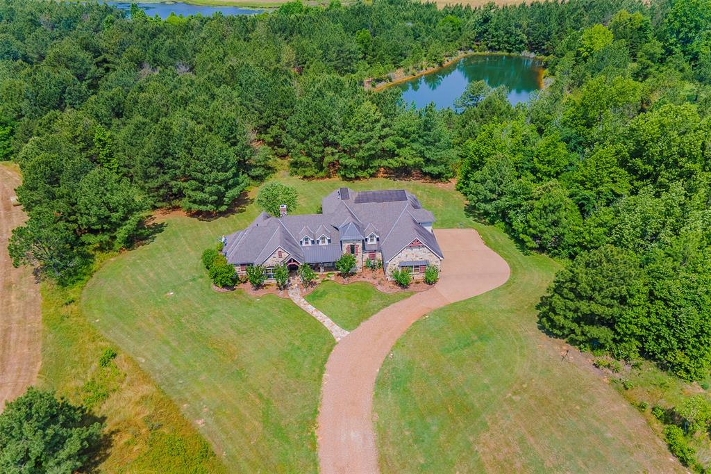 This gorgeous 4 Bed 4.5 Bath home in secluded Cross Pines Ranch, an upscale 2,155 acre shared ownership ranch outside Mineola in near East Texas is the perfect escape from city life! With over 250 acres of stocked fishing lakes, an equestrian facility with 10 ranch horses, a gun club, clubhouse with pool and full time ranch staff, you can enjoy ranch life on your schedule. With just 40 5 acre homesites spread over 3.4 square miles of fenced and well maintained ranchland, you'll enjoy horseback riding, fishing, hunting, stargazing or just relaxing...all within 90 minutes of Dallas. Schedule your private showing today.