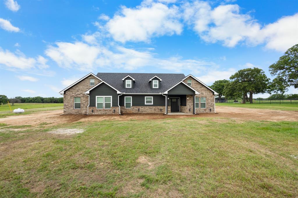 Country living at its finest in Sunset Texas! 3 Bedrooms and 2 bathrooms of exceptional craftsmanship is ready for its forever family. This builder takes his time and thinks of all the little details that you didn't even know you wanted. Heated fogless mirrors, granite counter tops throughout, home generator hookup, gas fireplace and so so much more. This kitchen has details such as oversized kitchen island with storage on both sides, a pantry tucked away in the most convenient corner, refridgerator, dish washer, microwave and disposal. Appliances in the kitchen stay in the kitchen to make moving just that much easier. Two different school districts to chose from, Bowie or Forrestburg.
The massive oaks on this property as well as the bright green costal grass makes the views breath taking. Drinking coffee on the porch, watching your horses graze, or letting the kids run free while you relax in the country are the things that dreams are made of. Located 10 mins from 287 and 20 mins from Decatur, nestled on a dead end road means quiet living with the convenience of the city just a short drive away! Schedule a showing today to come and see this 2.64 acre stunner of a new construction home.