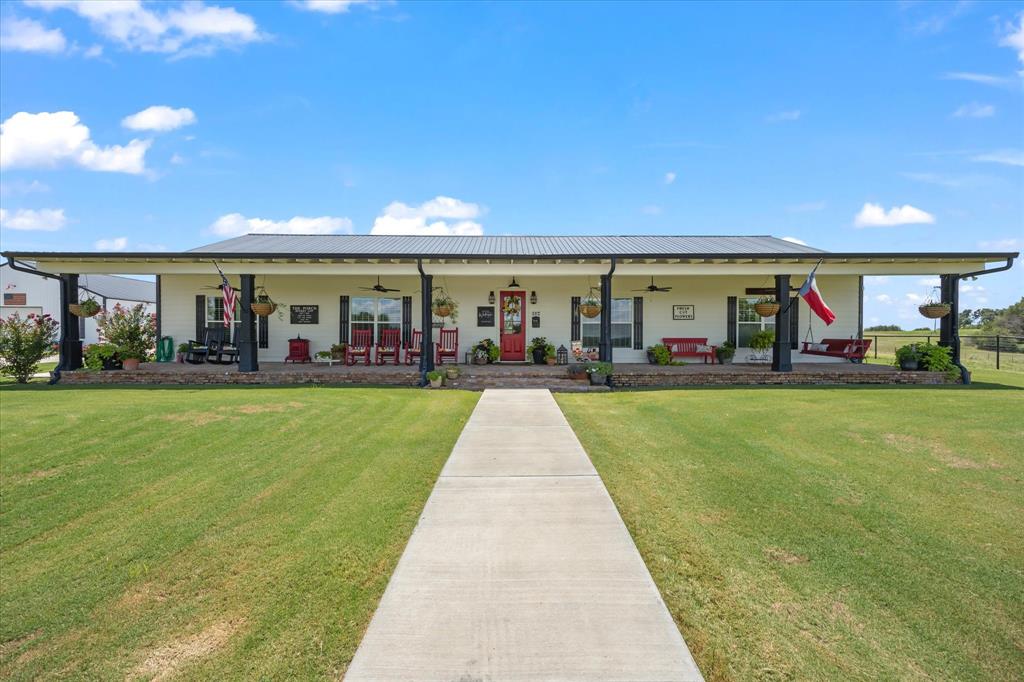 Located close to town, this home sits on 10 acres, on top of a hill. From front porch you can see downtown Stephenville and watch beautiful sunsets. There are four bedrooms, three full baths and an office. Open concept in kitchen area and all walls in kitchen and living area are covered in shiplap.Ten foot ceilings and eight foot doors are throughout home.Plantation shutters on all windows and fireplace is propane. Flooring is wood ceramic tile. Sprinkler system. Covered carport at back door doubles as an entertaining area. Home is spray foam insulated. Shop is foam insulated, 40x60, with a fully insulated well room with water softener, toilet in there. Firepit is under group of mature Oak trees. Property is fenced with electric gate, cattle pen, working chute and cattle guards. Generac Generator outside home. Come see! New 600 sq foot cabin on property, money making, and red covered bridge. RV hookup. What a dream place!
