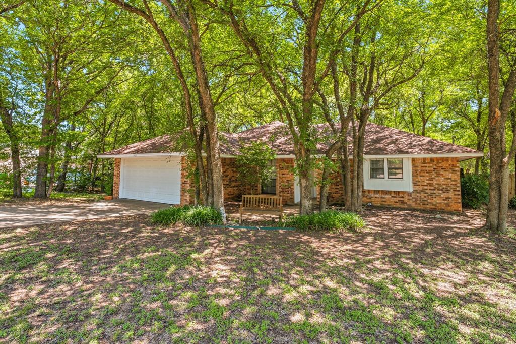 Come check out this charming 3-bedroom, 2-bath home located in a quiet, established Granbury neighborhood! This well-maintained home features a functional floor plan, comfortable living spaces, and a large fenced backyard with an abundance of trees and plenty of room for pets, play, and outdoor entertaining. Enjoy neighborhood amenities, including a community pool, and take advantage of being just minutes from Rough Creek Park and the public boat ramp for easy access to Lake Granbury. Don’t miss this wonderful opportunity to make it yours!