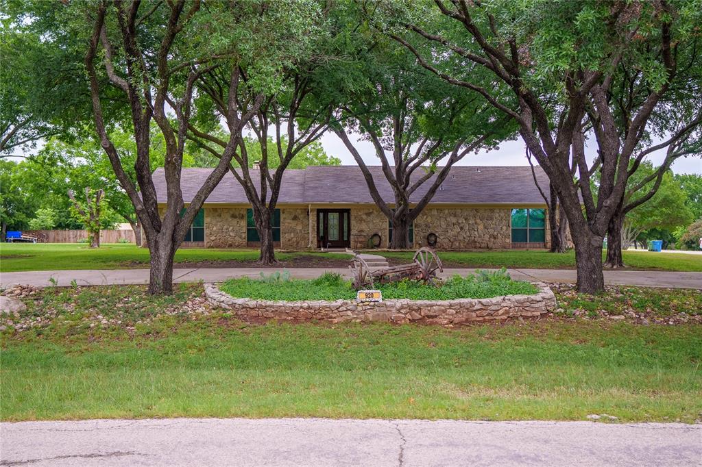 Nestled on 1.3 scenic acres in the Argyle ISD, this beautifully crafted property combines country charm with modern functionality. A great location away from the busy life but close enough to the conveniences. The striking stone exterior offers timeless curb appeal, while the expansive acreage provides room to roam, entertain, or simply enjoy peaceful Texas sunsets. A spacious metal shop adds incredible versatility for hobbies, storage, or your classic car. With plenty of open space and a serene setting, this property delivers the perfect blend of privacy, practicality, and rural luxury just minutes from town conveniences. The circular drive is wide enough for two vehicles so your guests will have plenty of parking. Three living areas provides space for everyone to spread out.