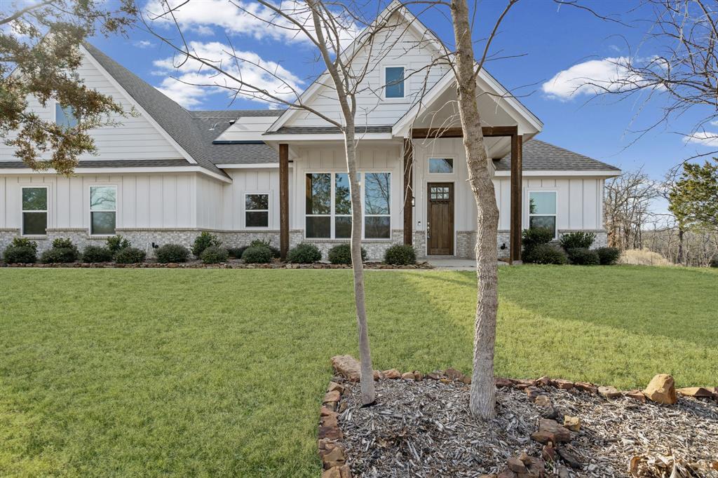 Discover the perfect blend of modern comfort, energy efficiency, and Texas space in this beautifully designed home situated on 1 acre. Featuring a split-bedroom layout and a highly desirable open floorplan, this property offers both privacy and seamless everyday living. The spacious living room is highlighted by a vaulted ceiling, creating an airy, light-filled atmosphere that flows effortlessly into the kitchen and dining areas.

The chef-inspired kitchen is equipped with a walk-in pantry, subway tile backsplash, farmhouse sink, and stainless steel appliances, including a gas cooktop, making it ideal for entertaining and daily use. Multiple large windows throughout the main living areas provide abundant natural light and showcase peaceful views of the expansive backyard.

The private primary suite features a spa-like bathroom with dual vanities, a separate tub and walk-in shower, and generous storage. Step outside to enjoy the covered patio with an outdoor fireplace, perfect for year-round entertaining, relaxing evenings, or hosting gatherings while overlooking your wide-open acreage.

This home is equipped with high value Tesla solar panels and a Tesla Powerwall, delivering low to no monthly electric bills and the rare ability to power the entire home during a grid outage, offering unmatched efficiency, sustainability, and peace of mind.

With its combination of energy-efficient features, modern finishes, open-concept design, and outdoor living space, this one-acre property is ideal for buyers seeking privacy, functionality, and long-term savings—all without sacrificing style or comfort.
