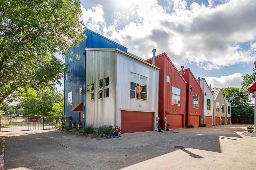 Incredibly rare opportunity to purchase 2 side by side townhomes in vibrant East Dallas. This small gated townhome community is in the heart of Dallas - minutes to downtown, the Arts District, Baylor Medical Center, Lower Greenville and walking distance to iconic Deep Ellum. Even though you are close to everything, the community feels private & friendly. The colorful industrial exterior leads you to loft style interiors with soaring ceilings, great natural light & designer touches throughout. The current owners have created a doorway to connect unit F & unit G on the ground floor - so they function perfectly as separate, but connected living units. This has been an ideal arrangement for multi-generational living but would also function beautifully to live on one side & work on the other. The beautiful natural lighting would create an ideal artist studio. Plans have also been penned to modify the floor plan to create one XL living unit which would feature 5 bedrooms, incl 2 primary suites, 4 full & 1 half baths and 4 garage spaces - with over 3700 square feet of living space. It would also provide a fenced yard space large enough for a hot tub or small pool. The possibilities are truly endless. As they stand today - these townhomes are impressive and uniquely individual. Both feature 14' high vaulted ceilings & incredible light filled spaces. Unit G is an end unit with additional windows & warm wood flooring that gives it a comfortable, lived-in feel. Unit F feels sleek and modern but still grounded & cozy. Each unit has a fireplace in the living room & views of downtown. The neighborhood offers easy & convenient living with a grocery store minutes away & beautiful Exall Park & Recreation Center around the corner offering 10 acres of community green space. An easy walk to Jimmy's Food Store, a classic Italian market; or Common Good - a favorite neighborhood coffee & record shop. Tons of great vintage shopping within walking distance as well. You will LOVE living here