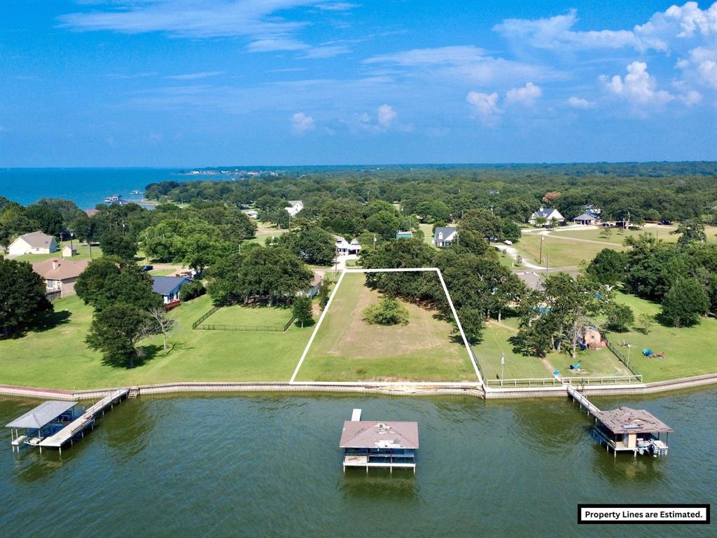 Discover your own slice of paradise on beautiful Richland Chambers Lake in the sought-after Rustling Oaks subdivision! This stunning waterfront lot offers over 100 feet of lake frontage, creating the perfect setting for your dream lake home. Retaining wall and boat house will need to be repaired at buyer's expense. Imagine waking up to breathtaking sunrises and winding down with unforgettable Texas sunsets reflecting across the water. Enjoy the peaceful lake lifestyle with community amenities including a fishing dock and lake access, perfect for boating, fishing, relaxing, and making lifelong memories. Mature surroundings and tranquil views make this property feel like a true retreat while still being conveniently located near Fairfield and Corsicana amenities. Whether you are looking for a weekend getaway or a full-time waterfront escape, this property offers endless potential to build the custom home you have always envisioned. CCRs available in Transaction Desk. Come experience the beauty, serenity, and charm of Richland Chambers Lake and make this incredible waterfront property your own!