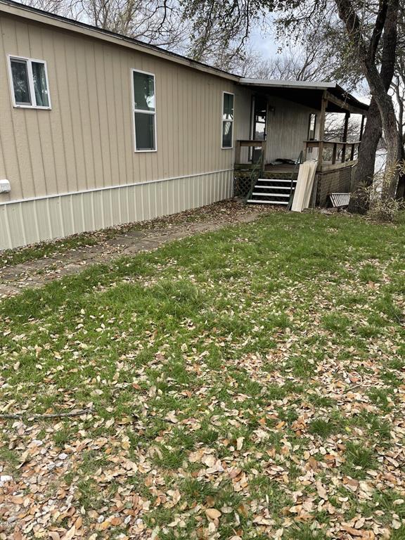LOOKING FOR A LAKEFRONT RETREAT OR A LAKEFRONT HOME ON BEAUTIFUL LAKE BROWNWOOD THIS FRESHLY REMODELED 1985 3B 2B MOBILE  HOME 1216 SQ FT COULD BE WHAT YOU ARE LOOKING FOR. FULLY FURNISHED WITH ALL APPLIANCES. LOCATED IN HARBOR POINT NORTH SIDE OF THE LAKE. SELLER INSTALLED  NEW PLUMBING AND NEW GAS LINES. YOU COULD BE RELAXING ON TWO DECKS ONE COVERED AND THE OTHER ONE HAS A GREAT VIEW OF THE LAKE! LOCATED IN A SECURE COMMUNITY OFFERING WITH THE HOA BOAT RAMP ACCESS THAT IS VERY CLOSE TO THIS PROPERTY.
ALSO OFFERS SWIMMING POOL ACCESS AND KIDS PLAYGROUND EVERYTHING YOU WILL NEED FOR RECREATION. YOU WILL BE ABLE TO RIDE YOUR GOLF CARTS AND 4 WHEEKERS IN THIS DESIRABLE COMMUNITY. THERE IS A SMALL STORAGE BUILDING ON PROPERTY. THE BOAT DOCK 806 SQ FT  HAS ONE BOAT SLIP AND A SWIM PLATFORM LIFT THAT WAS A JET SKI LIFT, IF YOU REMOVE BOARDS COULD BE CONVERTED BACK TO JET SKI LIFT. PER SELLER THE DEPTH OF WATER UNDER END OF THE DOCK IS APPROX. 13 TO 14 FT DEEP AT END OF DOCK.