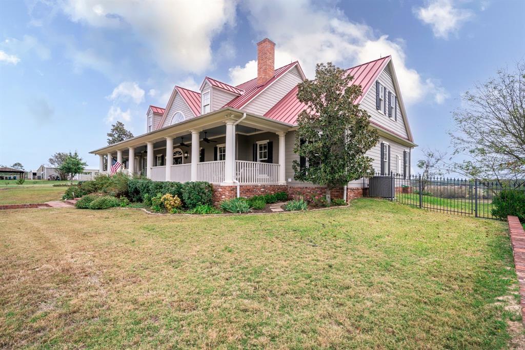 Beautiful & Functional Ranch in East Texas
A Tranquil Oasis Welcome to 8893 FM 2710, a remarkable East Texas ranch nestled just a few miles north of I-20 in Lindale, Texas. This property offers a picturesque setting and a wealth of amenities. 92+ Acres of rolling hills, this ranch features a perfect blend of open pastures, wooded areas, creeks, and a spring-fed lake. The main home boasts 5152 SF of living space, thoughtfully designed with five bedrooms and four bathrooms. Marvin Windows and Sliding Doors, spray foam insulation, a metal roof, and cement fiber exterior siding ensure year-round comfort. Choose between the 585-SF front porch with a porch swing or the 540-SF cedar-beamed covered back patio & enjoy breathtaking views. The property includes a 1000-SF apartment. And a 1500-SF Barn dominium, This structure features a 52 GPM well with a constant pressure pump, 100 amps of power, water, & septic already run to an additional pad, and 480 amps of power for multiple homes or shops