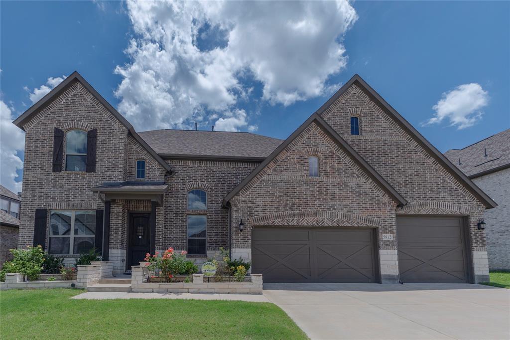Welcome to this exceptional north-facing home in highly acclaimed Prosper ISD, where elegance, functionality, and modern comfort come together on an oversized homesite. Offering 5 bedrooms, 4.5 baths, a private office, media room, game room, and a rare 5-car garage, this residence is designed for both luxury living and effortless entertaining.

A grand two-story foyer showcases a sweeping curved staircase, soaring ceilings, rich hardwood floors, designer lighting, and abundant natural light. The chef's kitchen features custom white cabinetry, an oversized island, farmhouse sink, stainless steel appliances, gas cooktop, walk-in pantry, and generous workspace, all opening to the spacious family room anchored by a striking floor-to-ceiling fireplace.

The flexible floorplan includes two bedrooms downstairs, including a luxurious primary suite with dual vanities, soaking tub, oversized shower, and customized walk-in closet. A dedicated executive office provides the perfect work-from-home setting.

Upstairs features three additional bedrooms, multiple ensuite baths, a large game room, lounge area, and media room—ideal for entertaining and multigenerational living.

The backyard is designed for year-round enjoyment with a covered patio, extended concrete entertaining area, vegetable and flower gardens, and a large storage shed. A rare 5-car garage with access to both the backyard and kitchen offers exceptional space for oversized vehicles, boats, golf carts, hobbies, or storage.

An expansive unfinished attic provides incredible potential for future flex space, climate-controlled storage, a fitness studio, or additional living area. 

Located in one of North Texas' most desirable communities near award-winning Prosper ISD schools, parks, trails, shopping, and dining, this remarkable home offers a rare combination of luxury, versatility, and future potential.

More than a home—it's a lifestyle. Welcome to 5812 Hightower Street.