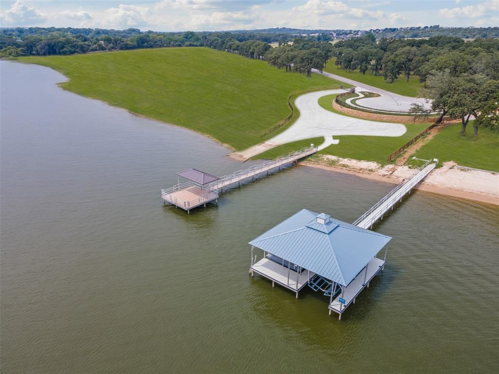 Build your dream home at Waterfront on Park—an exclusive enclave nestled along the serene, south-facing shoreline of Eagle Mountain Lake. This premier lot offers over one acre of unobstructed lake views, more than 110 feet of private shoreline, and ample space to create your ideal retreat. Located on the site of a former city park, these rare homesites offer direct lake access and are just minutes from the vibrant heart of Downtown Fort Worth.