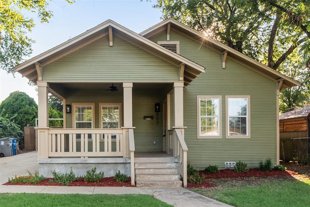 Nestled in the heart of Sunset Hill, this thoughtfully reimagined Craftsman seamlessly blends historic character with modern comfort. Originally taken to the studs and expanded to create a true luxury primary retreat, the home offers the charm buyers love about North Oak Cliff with the updates today's lifestyle demands. A welcoming front porch sets the tone, leading into light-filled living and dining spaces anchored by a decorative fireplace, hardwood floors, and timeless architectural details. The open-concept kitchen features quartz countertops, a breakfast bar, abundant cabinetry, and effortless flow for both everyday living and entertaining. The spacious primary suite is a rare find for the neighborhood, offering a large walk-in closet and an adjoining flex space perfect for a home office, nursery, reading room, or fitness area. The recently remodeled spa-inspired primary bathroom features dual vanities, a freestanding soaking tub, and an oversized walk-in shower designed for relaxation. Extensive improvements include updated electrical, plumbing, windows, flooring, decorative and recessed lighting, and thoughtfully curated finishes throughout. A dedicated mudroom and utility room provide everyday convenience. Outdoor living is equally inviting with a large rear deck, custom cedar carport, privacy fencing, and a newly added storage building offering valuable space for tools, hobbies, and seasonal storage. Enjoy the best of North Oak Cliff living with convenient access to the Bishop Arts District, Stevens Park Golf Course, and Downtown Dallas. This move-in ready home delivers the perfect balance of historic charm, modern functionality, and one of the area's most desirable locations. Buyer and Buyer's Agent to verify all information contained herein. Buyer will need to obtain a new survey.