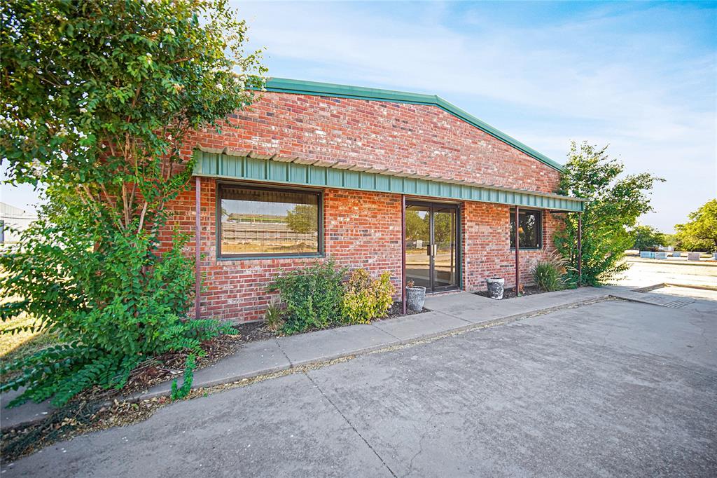 Commercial office or mixed-use property one block from downtown Jacksboro, TX. This property, built in 2003, is in excellent condition and is suited for a wide array of businesses or uses. The building is 2,400 square feet with the front 1,200 square feet being office and the back 1,200 square feet being insulated warehouse or shop space. The office opens up into a very large reception room with 10’ ceilings. The office space includes two large offices, full kitchen, restroom and one additional room for copiers or storage. The building is located on 0.63 acres, and the warehouse spaces has its own driveway.