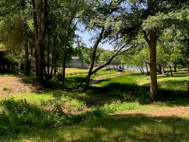 Quite remote getaway in a small waterfront community. 2 very affordable waterfront lots on small channel, that gently slopes to the water. Mature trees. Subdivision offers a fantastic Lauch ramp just around the corner. Add your tiny home, mobile home or build, your choice. Great East Texas feel in this location.
Looking to retire or just a weekend getaway, Golf Club nearby and great fishing too!