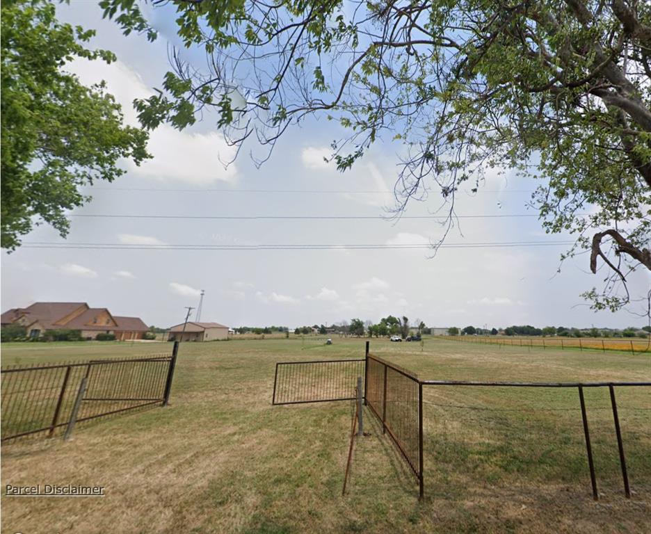 LOOK!!  Nearly 5 acres of fully fenced land with a small pond.    A must see of prime real estate.  Offering approximately 500 feet of frontage ( 250 at the front and 250 feet at the, per survey).  Endless potential for building, recreation, or investment.