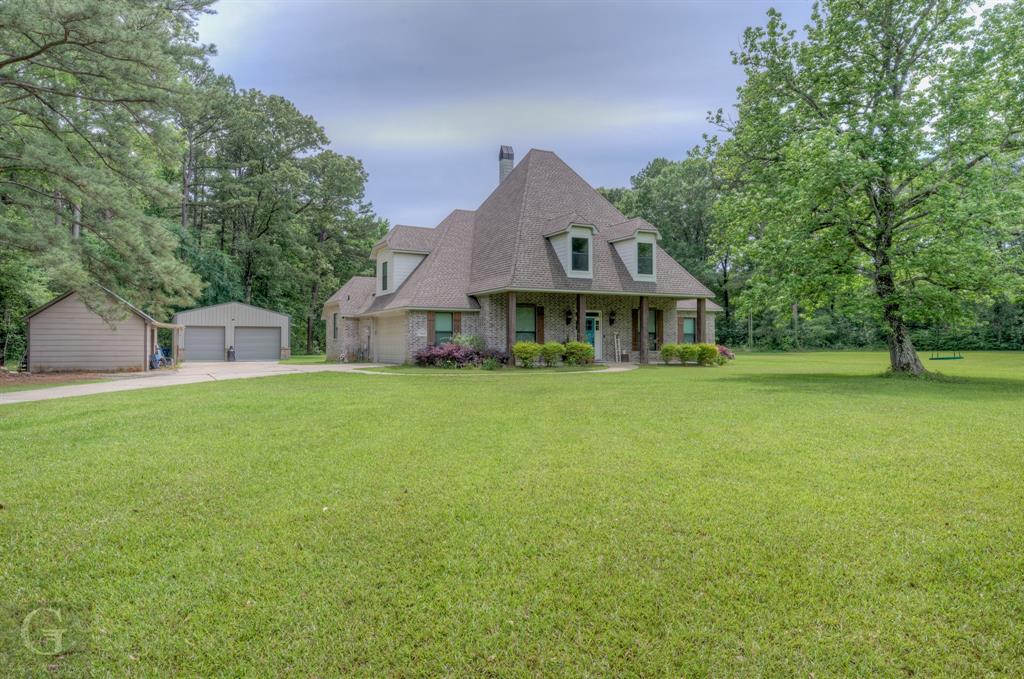 Rare find on 7 acres. Hot water & gas hookup on the exterior of the home. Tankless hot water heater. Insulated garage door. 2 workshops with electric: 24x30 & 15x25. The neighbors are always friendly. Part of the upstairs can be used as a 4th bedroom. This home sits behind the home that has road frontage on Shirley Francis. This home is not in a flood zone. Will come with a 1 year Guard Home Warranty with a favorable offer to the seller.