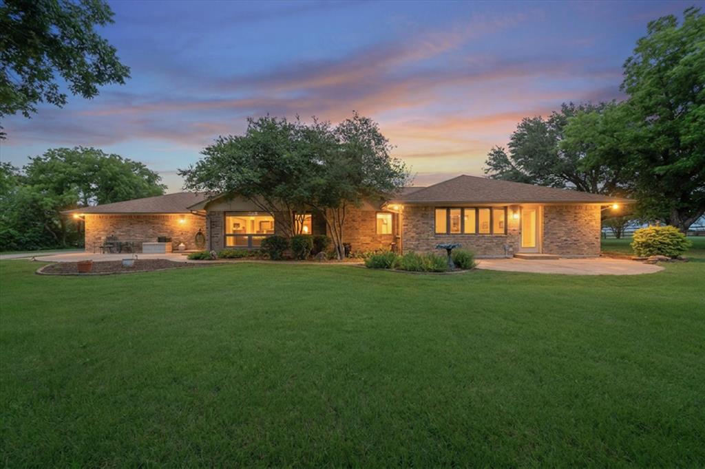 Discover the perfect combination of country living, privacy, & functionality at 1328 Bear Creek Road in Cedar Hill. Nestled on 6.6 picturesque acres, this exceptional property offers a beautifully maintained home, multiple outbuildings, & a peaceful setting complete with a seasonal pond.

Inside, you'll find spacious living areas filled with natural light, wood finishes, & expansive views of the surrounding property. The interior was freshly painted in 2026, creating a bright & welcoming atmosphere. The large living room features stonework, exposed beams, & plenty of space for gathering and entertaining. Look for the hidden room in the den. 

The kitchen is designed for both everyday living and hosting, featuring abundant cabinetry, generous counter space, an eat-in area, & a breakfast bar with attached swivel stools. Whether preparing meals or enjoying coffee, this space serves as the heart of the home.

Outside, the property's versatility truly shines. A 60x40 shop is equipped with water & electricity, making it ideal for a workshop, additional car or RV storage, livestock, or business use. This building can hold 4 additional cars or RV & Boat storage. The shed includes built-in cabinets, electric, & water access just outside the wall. A separate tool shed features both water & electricity inside, providing additional workspace & storage options. At the rear of the property, a massive 92x52 barn offers substantial storage & flexibility for agricultural, recreational, or equipment needs. 

The acreage provides room to roam, enjoy outdoor activities, keep animals, or simply take in the peaceful surroundings. Mature trees, open space, & the seasonal pond create a tranquil setting while remaining conveniently located near Cedar Hill amenities.

Whether you're searching for a private retreat, a hobby farm, a property with extensive workshop space, or a home that offers room to grow, this unique acreage property delivers exceptional opportunity and value.