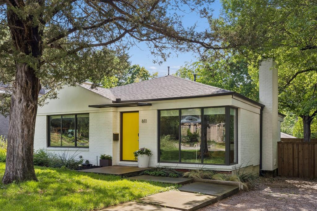 Stylishly restored and thoughtfully reimagined, this West Kessler modern cottage pairs clean architectural lines with effortless everyday livability. Behind its charming façade, a comprehensive renovation in 2011—spanning flooring, walls, windows, electrical, plumbing, insulation, fixtures, and finishes—delivers both peace of mind and elevated design, brought to life by the creative team at Punchworld Studio.
Inside, dramatic floor-to-ceiling pane-less windows bathe the interiors in natural light, blurring the line between indoors and out. The sleek kitchen serves as the heart of the home, showcasing crisp white lacquer cabinetry, premium stainless steel appliances, and quartz countertops—perfectly suited for both daily living and entertaining.
And for those who love to host, there’s a moment of surprise: a hidden bar discreetly tucked behind a custom bookshelf—because, after all, books are simply better with bourbon. The serene primary suite offers a true retreat, complete with a tranquil Zen garden, a spacious walk-in closet, and a spa-inspired bath finished with refined quartz surfaces. Efficient use of space throughout including a generous walk-in closet.
The home offers a coveted two car attached garage and a spacious storage unit was added in May 2025. 
All of this in a stellar West Kessler location with NEW sidewalks being installed to make your quick jaunt to the golf course even more convenient. Only 2 miles to Bishop Arts, 5 miles to DT Dallas and just a few blocks to the golf course.