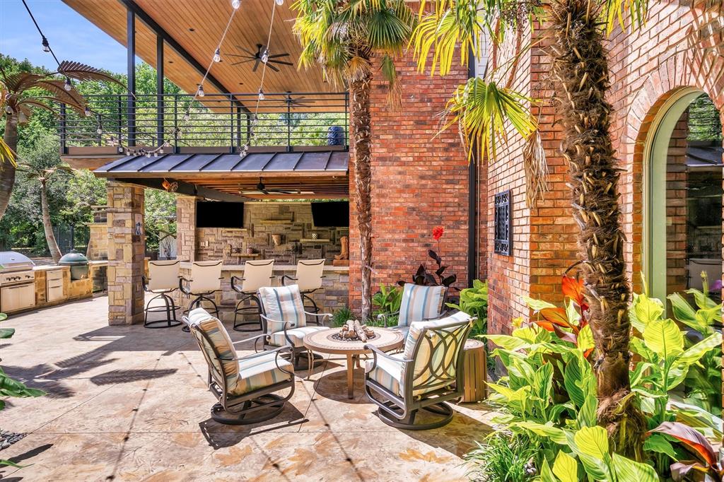 An amazing opportunity to own in prestigious Dublin Road Estates and positioned on 4+ private acres, this exceptional property delivers a rare combination of refined living and unmatched outdoor entertaining. The massive backyard is truly the heart of the home, highlighted by an impressive 60’ x 60’ recreational barn. Thoughtfully designed for gatherings of any size, the grounds include an outdoor living center with a large built-in bar, pizza oven, built-in grill, putting green, and multiple turf areas, along with an outdoor fireplace and extended covered patio—creating a one-of-a-kind setting for both everyday enjoyment and memorable occasions. The secluded primary suite offers a private retreat with a fireplace, spa-like oversized shower, and an exceptional walk-in closet that is the size of a small boutique—one of the largest you’ll see at over 500 sf—complete with a washer + dryer, dual sinks, and a TV. The open floor plan flows from the well-appointed kitchen into 2 dining areas, a butlers pantry and a large living space. The kitchen has a built in refrigerator, dual dishwashers, pot filler and an oversized gas cooktop. Find an in-law suite downstairs a with it's own living room. Also, natural hardwood floors, a cedar closet, and great storage throughout. Upstairs includes 2 bedrooms & 2 full baths, a large game room with wet bar, and a covered balcony with Azek decking. The expansive 60' x 60' climate-controlled outbuilding includes 20-ft ceilings, finished concrete floors, a spacious game room, dual half baths, and upstairs guest quarters—complete with a 3-car carport and additional garage spaces, ideal for luxury hobbies or entertaining. The oversized circle driveway, extensive outdoor lighting, 2 tankless water heaters, whole house foam insulation, huge walk in attic. Additional 12' x 13' shed could hold a golf cart. Small pond at the back of the property.