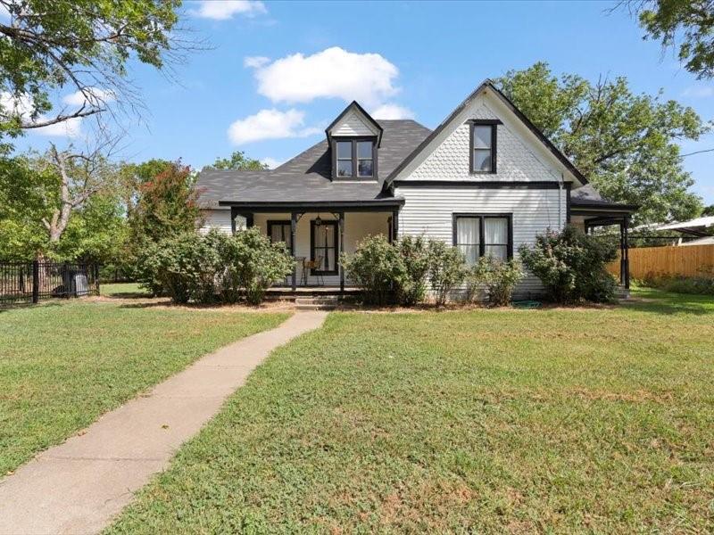 Step into charm and space you won’t find anywhere else at this price! This updated two-story offers 5 bedrooms, 2 bathrooms, and flexible living areas with original hardwood floors, two dining spaces, and dual living rooms. Enjoy outdoor living on a large quarter-acre lot with two covered porches and a fully fenced yard. Conveniently located near I-35 for a quick commute, this home blends timeless character with modern comfort—don’t miss it!