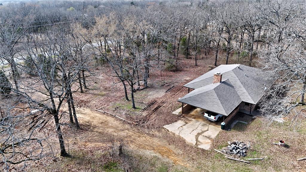 Located HALF mile from Cedar Creek Lake, this prime 10-acre property is nestled between two established developments, The Bluffs and Cedar Creek Ranch. The land offers a balanced combination of open pasture and wooded areas, creating a versatile mix of usable ranch land and natural wildlife habitat.  The brick ranch-style home features 3 bedrooms, 1.5 bathrooms, attached two-car carport. Additional improvements include a barn, storage shed, a pond. The property is serviced by deep Wilcox water. Enjoy peaceful country living with room to spread out, NO RESTRICTIONS, this property provides flexibility for a variety of uses while surrounded by restricted, gated developments on both sides of this property. Opportunities like this are becoming harder to find, don’t miss this rare offering.