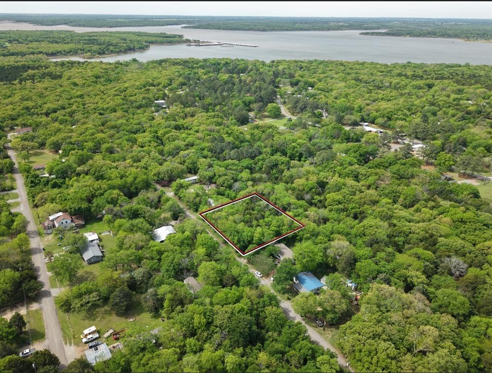 If you have a vision for what could be done with nearly half an acre not far from the lake with a densely treed lot, take a look at this. The lot is near Paradise Cove and the Mill Creek areas of Lake Texoma.