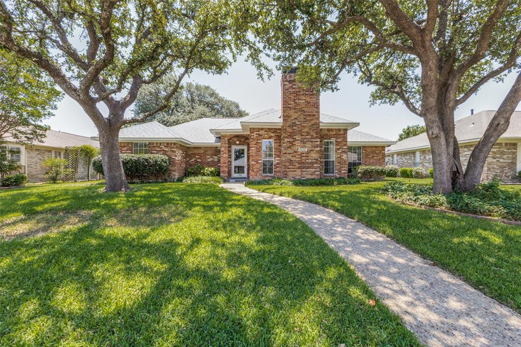 Within Richardson’s established Marlborough Square neighborhood, this refreshed single-story home pairs spacious interiors with a backyard rarely found at this price point. Framed by mature trees and set on an interior lot, the property offers a comfortable balance of openness, privacy, and everyday functionality. The main living area immediately stands out with vaulted ceilings, exposed wood beams, custom trim work, and a floor-to-ceiling fireplace that creates a strong focal point for the space. Large windows bring in natural light throughout the day, while the updated flooring and neutral palette give the home a clean, cohesive feel. The kitchen has been updated with quartz countertops, freshly painted cabinetry, subway tile backsplash, modern hardware, island seating, and extensive cabinet storage. A breakfast area sits just off the kitchen, while a separate dining room provides additional flexibility for gatherings and holidays. The layout includes four bedrooms, including a spacious primary suite with dual walk-in closets, dual vanities, a soaking tub, and separate shower. One secondary bedroom features custom built-in shelving and works equally well as a home office, library, or flex space. A full utility room with built-in cabinetry and pantry storage adds practical everyday convenience. One of the standout features of the property is the backyard. Beyond the covered patio, the expansive grassy yard offers an exceptional amount of usable outdoor space with room for entertaining, play, gardening, pets, or future pool plans, all shaded by mature trees and enclosed by updated fencing. Located just down the street from Jess Harben Elementary, the home also offers convenient access to Springridge Elementary School, CityLine, Firewheel Town Center, Breckinridge Park, and Richardson’s growing dining and retail corridor. Quick access to US-75 and George Bush Turnpike allows for an easy commute throughout Richardson, Plano, and North Dallas. Zoned Richardson ISD.